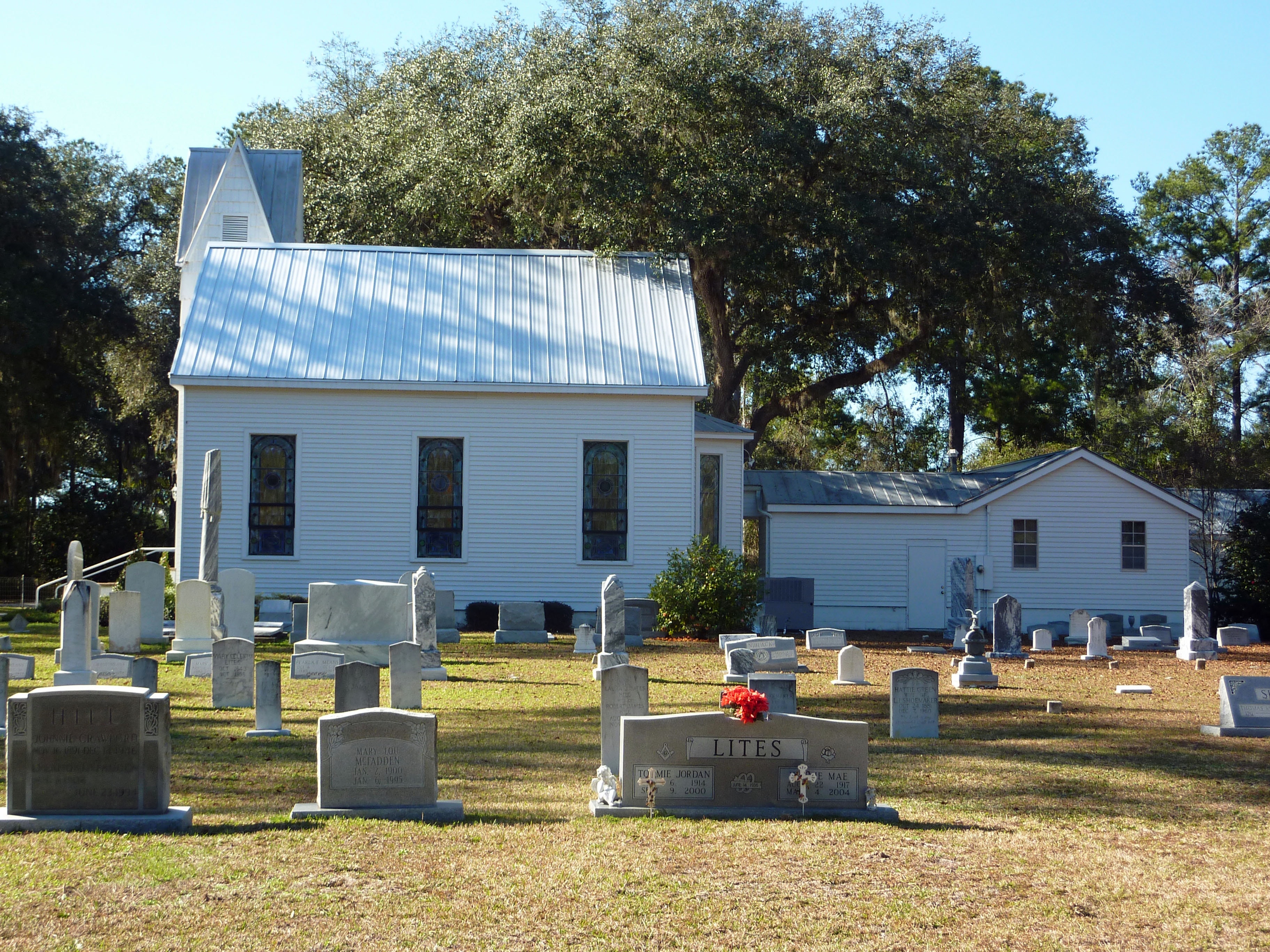 Mikesville Presbyterian Church with historic cemetery and stained glass windows